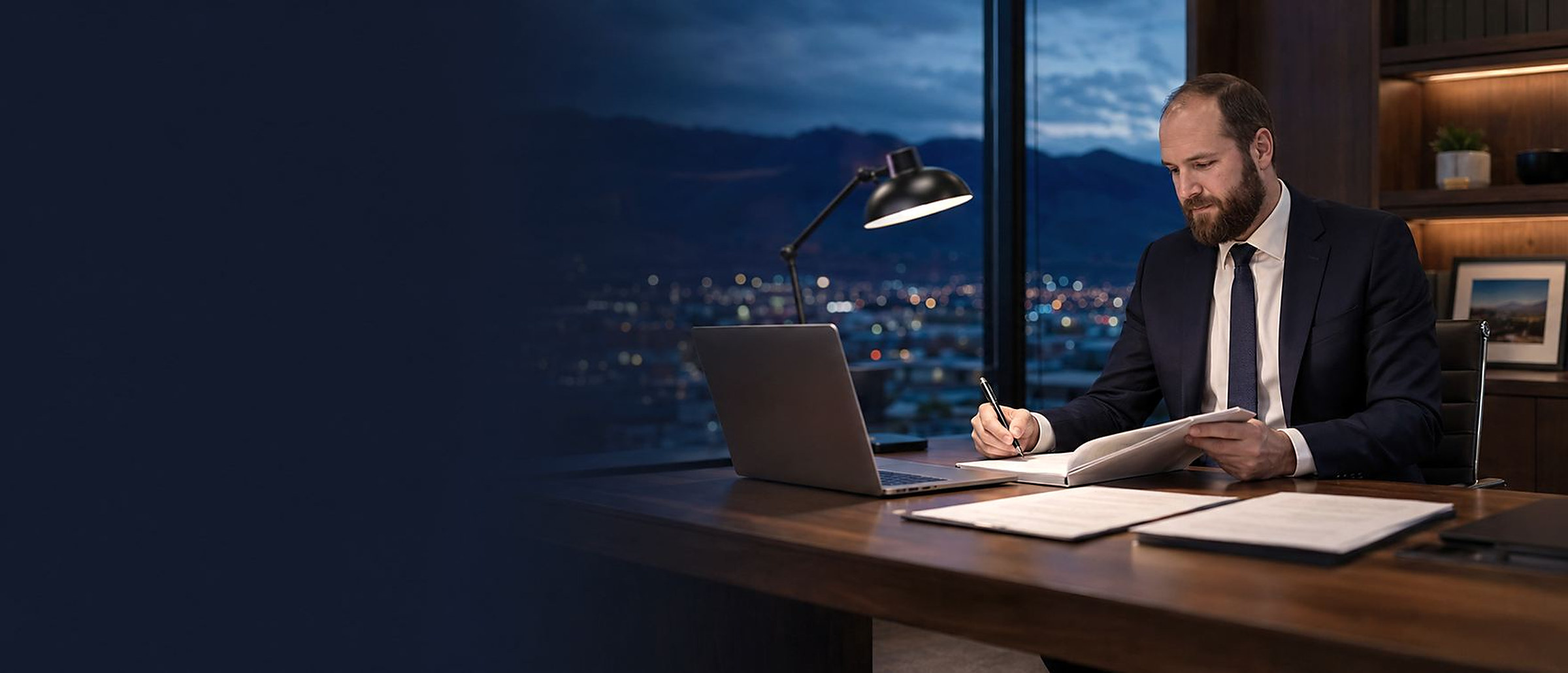 Reno appellate attorney reviewing an appeal brief at his desk at night